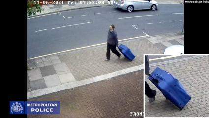 CCTV footage of Jemma Mitchell dragging a large blue suitcase