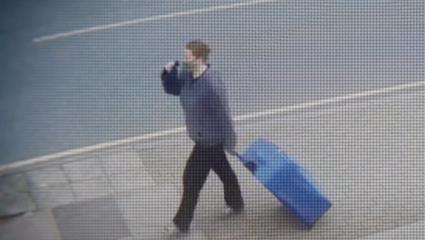 Jemma Mitchell dragging a suitcase