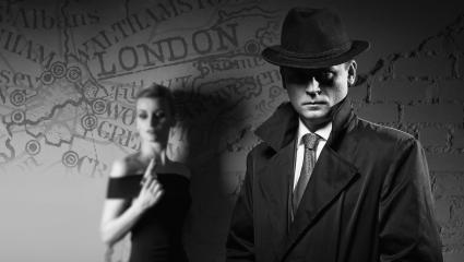 A photograph of a 1940s couple with an old map of London, UK in the background