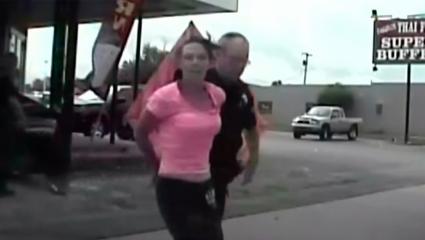Police dashcam footage of a woman being arrested