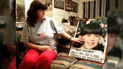 Donna Norris touches a photo of her daughter, Amber Hagerman