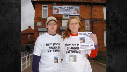 Karen Matthews with her partner Craig holding a poster appealing for her daughter
