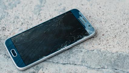 A smashed smartphone on the floor