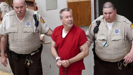 Drew Peterson being led away by police