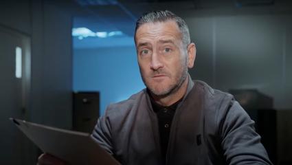 Will Mellor holding a case file