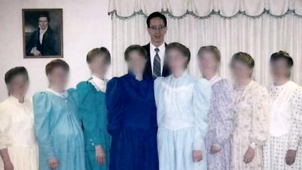 Warren Jeffs with eight female members of the FLDS whose faces have been blurred