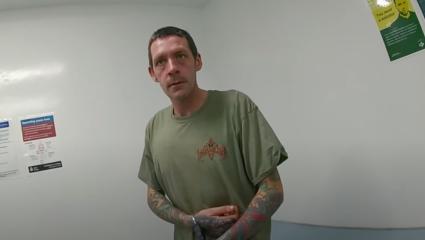 Mark Brown at the police station after being arrested