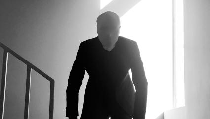 A depiction of Slender Man - a faceless, humanoid figure