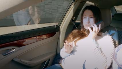 Gypsy Rose Blanchard using her mobile phone while in the passenger seat of a car