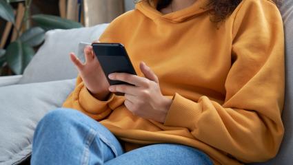 A woman scrolling on her smartphone