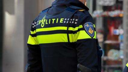 Back of a Dutch police officer in uniform