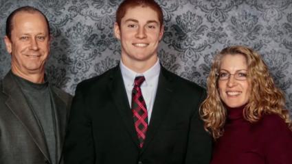 Tim Piazza standing with his parents 