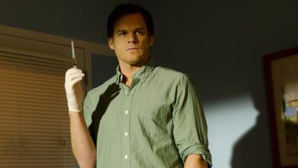 Michael C Hall holding a syringe while portraying 'Dexter'