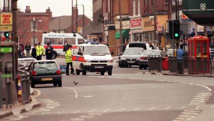 Police inspect an explosion on Eltham High Street that they believe was set off by the Mardi Gra Bomber