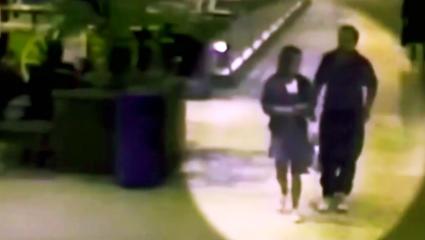 Blurry CCTV footage of Jane Harrison and her partner in a shopping centre