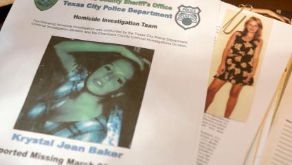 A missing poster for Krystal Jean Baker lies on top of her case file