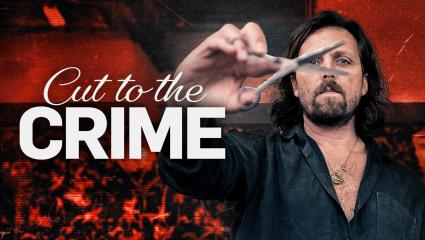 'Cut to the CRIME' - James Busby holding his scissors up to the camera