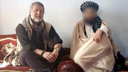 Ian Purchase photographed meeting a member of the Taliban