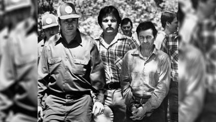 Donald Henry 'Pee Wee' Gaskins wearing handcuffs while surrounded by officers