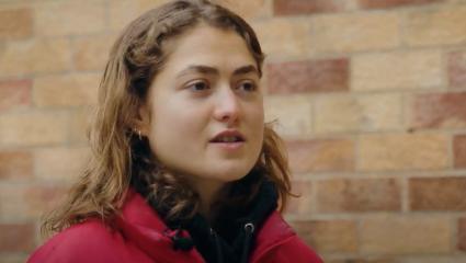A woman speaking on a North London street