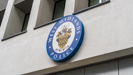 External signage of the West Midlands Police crest outside of Police Headquarters at Lloyd House, Birmingham