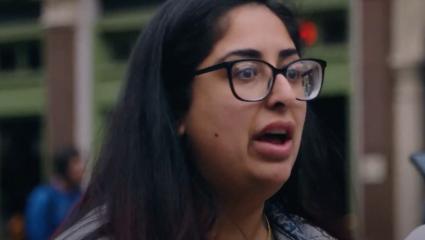 A young woman talks about crime on a London street