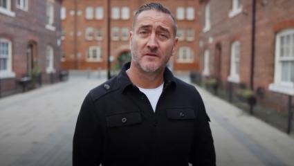 Will Mellor talks to the camera while walking down the street