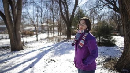 Kerri Rawson (daughter of Dennis Rader) standing in a snowy, empty backyard