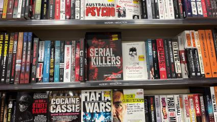 A section for true crime books in a bookshop
