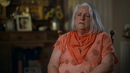 Molly McLaren's mother, Joanne, discussing the circumstances of her daughter's murder. She is sitting on a chair inside a room in her house and speaking to camera.