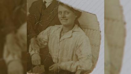 Black and white torn photograph of Louisa Dunne when she was believed to be in her late twenties