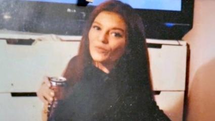 Sarah Henshaw posing in a personal photo with a can in her hand