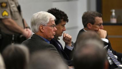 Thomas Martens sitting with his attorneys in court