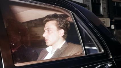 Colourised image of Ian Brady in the back of a police car