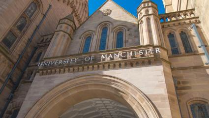 The Whitworth Building - a grand building with a sign reading 'UNIVERSITY OF MANCHESTER' on the front