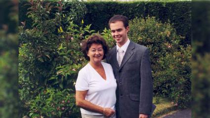 Brian Blackwell posing for a family photograph with his mother