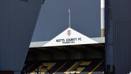 Notts County's home stadium. An image of one of the stands with 'NOTTS COUNTY FC - FOUNDED 1862' written on top of it