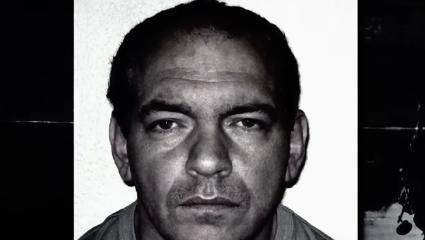A black-and-white mugshot showing Donald Andrews with short dark hair, a serious expression, and a neutral background behind him.