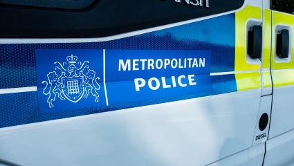 A Transit van with 'Metropolitan Police' branding on the side
