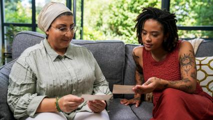 Yinka Bokinni sitting on a sofa with Dunia