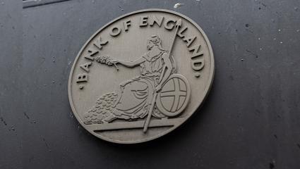 Bank of England crest on the side of a building