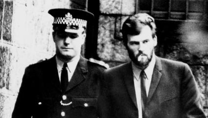 Brian Tevendale walking with a policeman