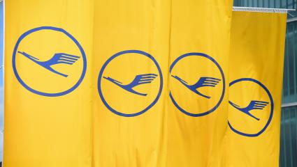 The Lufthansa logo on a series of yellow flags