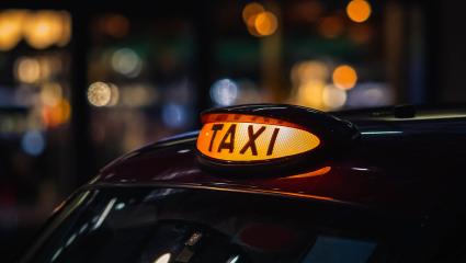 The light on top of a London taxi at night