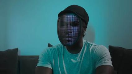A young man whose identity is hidden by an LED mask