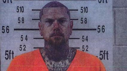 Adam Williams in his police mugshot