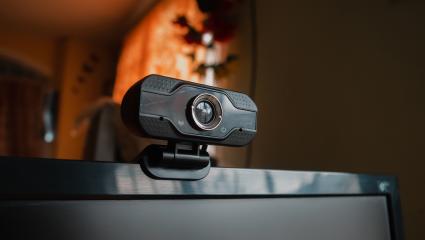 A webcam clipped to the top of a laptop screen