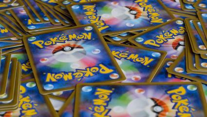 A large number of Pokemon cards spread out face down