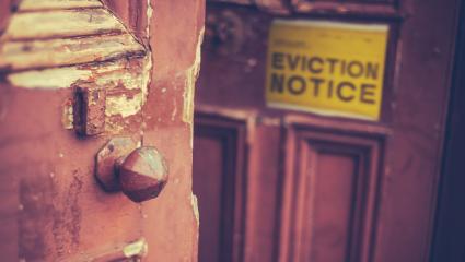 An eviction notice on an old door