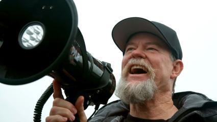 Flash Shelton uses a megaphone